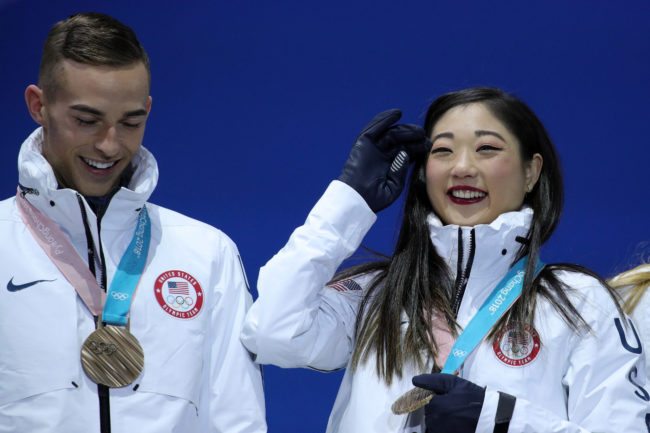 PYEONGCHANG-GUN, SOUTH KOREA - FEBRUARY 12: Bronze medalists Adam Rippon (L) and Mirai Nagasu of Team United States celebrate during the victory ceremony after the Figure Skating Team Event at Medal Plaza on February 12, 2018 in Pyeongchang-gun, South Korea. (Photo by Andreas Rentz/Getty Images)