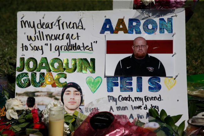 A memorial for student Joaquin Oliver and assistant football coach Aaron Feis, two of the victims of the Marjory Stoneman Douglas High School shooting, sits in a park in Parkland, Florida on February 16, 2018.   A former student, Nikolas Cruz, opened fire at the Florida high school leaving 17 people dead and 15 injured. / AFP PHOTO / RHONA WISE        (Photo credit should read RHONA WISE/AFP/Getty Images)