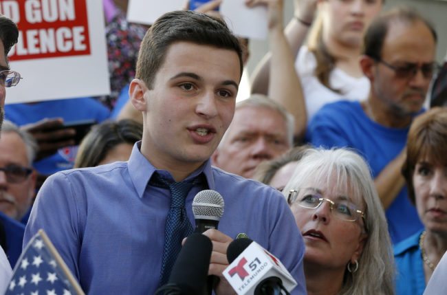 Marjory Stoneman Douglas High School student Cameron Kasky speaks at a rally for gun control at the Broward County Federal Courthouse in Fort Lauderdale, Florida on February 17, 2018.  Seventeen perished and more than a dozen were wounded in the hail of bullets at Marjory Stoneman Douglas High School in Parkland,Florida the latest mass shooting to devastate a small US community and renew calls for gun control. / AFP PHOTO / RHONA WISE        (Photo credit should read RHONA WISE/AFP/Getty Images)