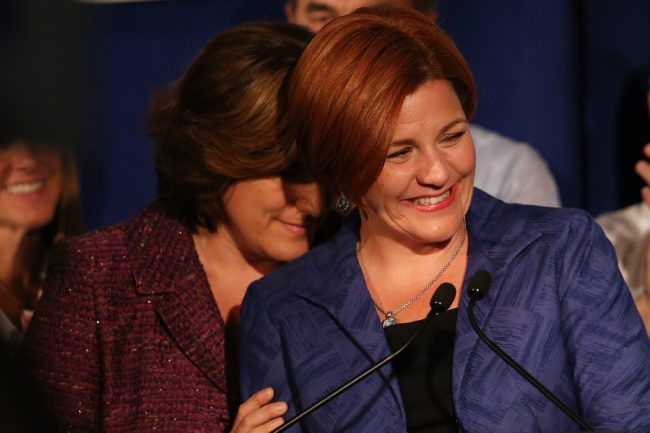 NEW YORK, NY - SEPTEMBER 10: New York City Council Speaker Christine Quinn speaks next to her wife Kim Catullo (L) during her concession speech in the New York Democratic mayoral primary elections on September 10, 2013 in New York City. Quinn, who lead early in the polls and who was endorsed by all of New York's major newspapers, saw her lead slip away in the final weeks of the campaign. Quinn would have been the first woman and lesbian to hold the job of mayor. (Photo by Spencer Platt/Getty Images)