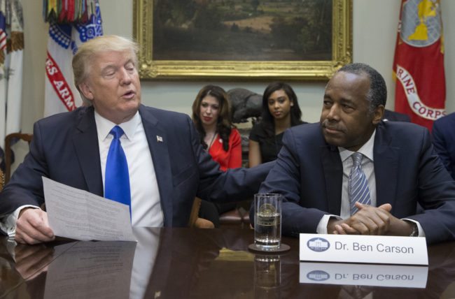 WASHINGTON, DC - FEBRUARY 1:  (AFP OUT) President Donald Trump (L), holds an African American History Month listening session attended by nominee to lead the Department of Housing and Urban Development (HUD) Ben Carson (R) and other officials in the Roosevelt Room of the White House on February 1, 2017 in Washington, DC. (Photo by Michael Reynolds - Pool/Getty Images)
