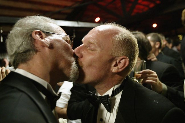 WEST HOLLYWOOD, CA - JUNE 1: Men kiss after exchanging marriage vows during a symbolic mass gay wedding celebrated by more than 100 same-sex couples on June 1, 2004 in West Hollywood, California. The ceremony kicks off National Gay Pride Month. (Photo by David McNew/Getty Images)