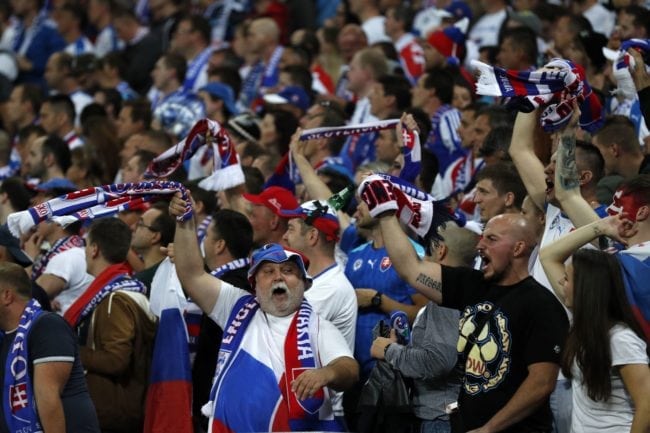 Slovakian fans cheer on their team during the World Cup 2018 qualification football match between England and Slovakia at Wembley Stadium in London on September 4, 2017. / AFP PHOTO / Adrian DENNIS / NOT FOR MARKETING OR ADVERTISING USE / RESTRICTED TO EDITORIAL USE (Photo credit should read ADRIAN DENNIS/AFP/Getty Images)