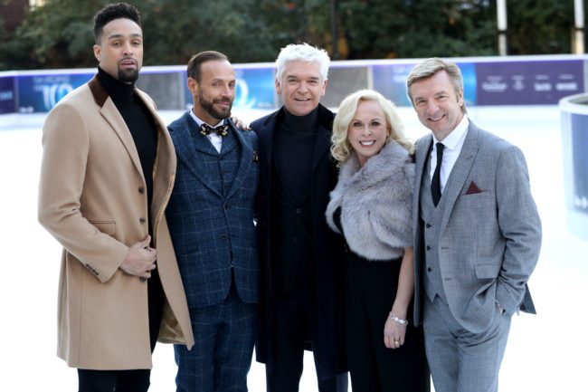 LONDON, ENGLAND - DECEMBER 19:  Presenter Phillip Schofield (C) poses with judges Ashley Banjo (L), Jason Gardiner (2ndL), Karen Barber (2ndR) and Christopher Dean (R) during the Dancing On Ice 2018 photocall held at Natural History Museum Ice Rink on December 19, 2017 in London, England.  (Photo by Chris Jackson/Getty Images)