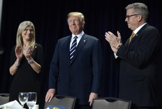 WASHINGTON, D.C. - FEBRUARY 8: (AFP-OUT) Rep. Randy Hultgren (R-IL) (R) and his wife Christy clap for President Donald Trump at the National Prayer Breakfast on February 8, 2018 in Washington, DC. Thousands from around the world attend the annual ecumenical gathering and every president since President Dwight Eisenhower has addressed the event. (Photo by Mike Theiler-Pool/Getty Images)
