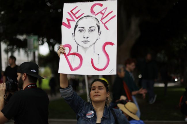 LOS ANGELES, CA - MARCH 24:  A woman holds a sign depicting Parkland shooting survivor Emma Gonzalez during the March for Our Lives rally on March 24, 2018 in Los Angeles, United States. More than 800 March for Our Lives events, organized by survivors of the Parkland, Florida school shooting on February 14 that left 17 dead, are taking place around the world to call for legislative action to address school safety and gun violence.  (Photo by Mario Tama/Getty Images)