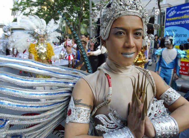 BANGKOK, THAILAND: Thai gays march in an annual "Gay Pride" parade on Silom road downtown Bangkok, 21 November 2004. Thai transvestites and homosexuals joined the parade along with some western counterparts at the end of their week long celebrations. AFP PHOTO/ SAEED KHAN (Photo credit should read SAEED KHAN/AFP/Getty Images)