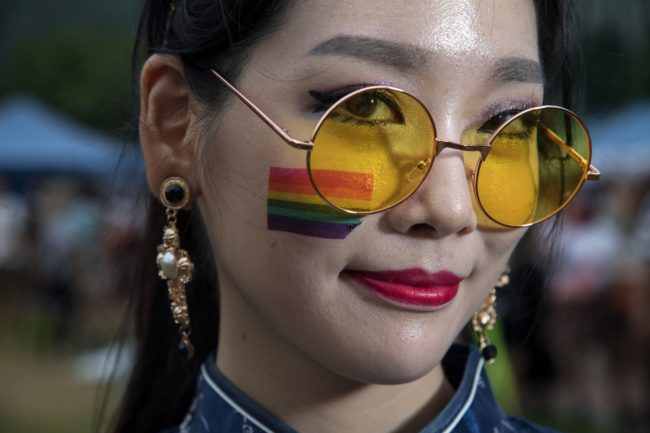 Participant Nae-Gyeol Song poses for a photo during a 'Gay Pride' gathering in Seoul on July 15, 2017. Thousands of people celebrated gay rights with song, dance and a march in Seoul on July 15, amid rain and boisterous protests by conservative Christians. Religious South Koreans have been a loud fixture at the annual parade for years, holding a rival anti-homosexuality rally while trying to physically block the march.     / AFP PHOTO / Ed JONES        (Photo credit should read ED JONES/AFP/Getty Images)