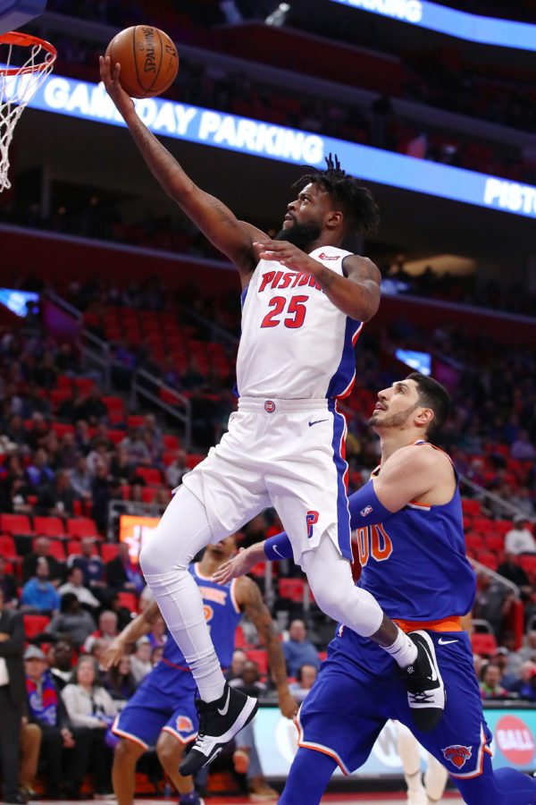 DETROIT, MI - DECEMBER 22:  Reggie Bullock #25 of the Detroit Pistons drives to the basket past Enes Kanter #00 of the New York Knicks during the first half at Little Caesars Arena on December 22, 2017 in Detroit, Michigan. NOTE TO USER: User expressly acknowledges and agrees that, by downloading and or using this photograph, User is consenting to the terms and conditions of the Getty Images License Agreement. (Photo by Gregory Shamus/Getty Images)