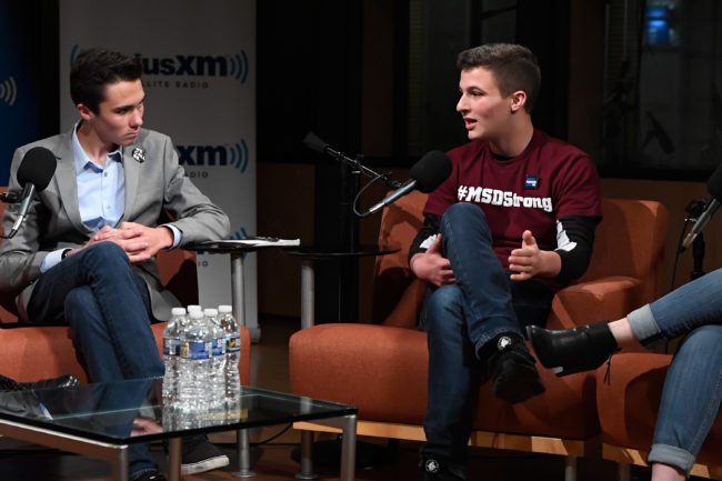 WASHINGTON, DC - MARCH 23: Dan Rather hosts a SiriusXM Roundtable Special Event with Parkland, Florida, Marjory Stoneman Douglas High School Students and activists Emma Gonzalez, David Hogg (L), Cameron Kasky (R), Alex Wind, and Jaclyn Corin at SiriusXM Studio on March 23, 2018 in Washington, DC. (Photo by Larry French/Getty Images for SiriusXM)