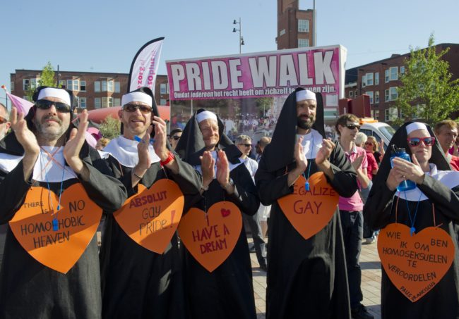 Homosexual and lesbian community members dressed as nuns participate in a Rainbow Pride Walk in Amsterdam, the Netherlands, on August 1, 2013. Hundreds of LGBT activists particpated in the rally to demand equal social and human rights for their community. The parade is part of Gay Pride Week. AFP PHOTO / ANP / MARCEL ANTONISSE   ***Netherlands out***        (Photo credit should read MARCEL ANTONISSE/AFP/Getty Images)