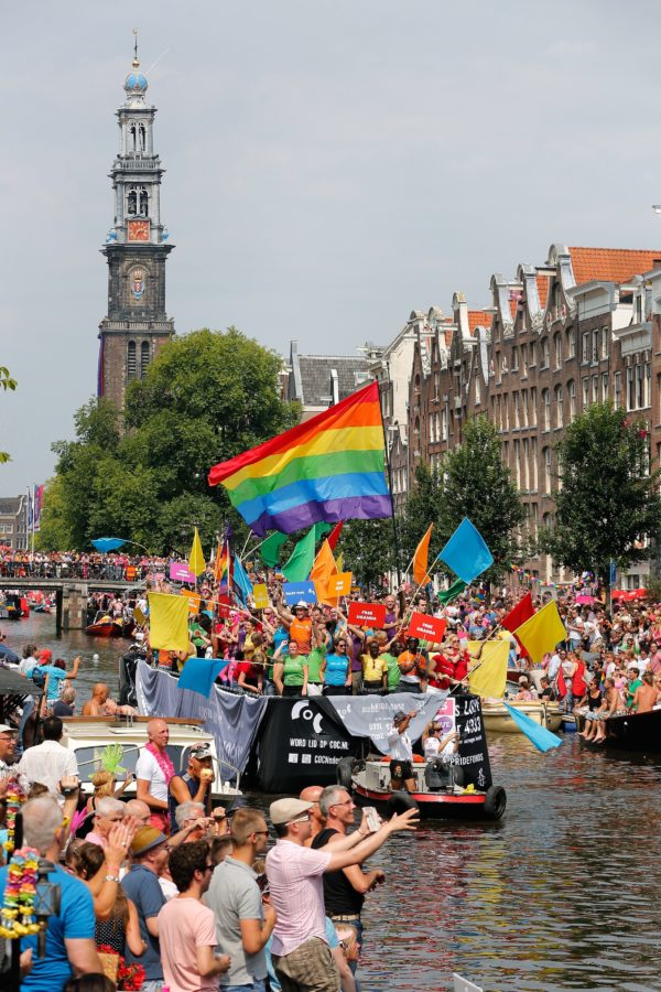 Members of the COC (Dutch organization for LGBT's) attend the annual canal parade in Amsterdam, on August 2, 2014. The parade is part of the Gay Pride Week. AFP PHOTO/ANP BAS CZERWINSKI netherlands out        (Photo credit should read BAS CZERWINSKI/AFP/Getty Images)