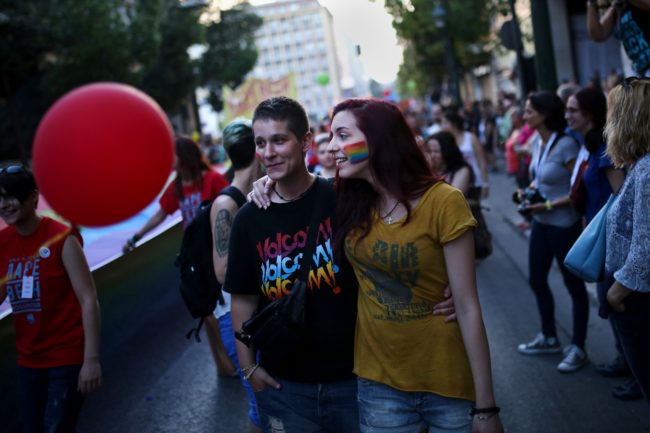 Two women take part in the annual Gay Pride parade in Athens, on June 13, 2015.  Greece's radical-left government on June 10, 2015, proposed a bill to grant same-sex couples the right to a civil union, two years after the European Court of Human Rights condemned the country's existing legislation as discriminatory. AFP PHOTO / ANGELOS TZORTZINIS        (Photo credit should read ANGELOS TZORTZINIS/AFP/Getty Images)