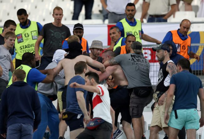 Groups of supporters clash fight at the end of the Euro 2016 group B football match between England and Russia at the Stade Velodrome in Marseille on June 11, 2016. / AFP / Valery HACHE (Photo credit should read VALERY HACHE/AFP/Getty Images)