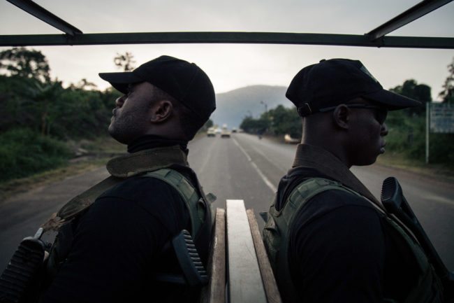Soldiers of the 21st Motorized Infantry Brigade patrol in the streets of Buea, South-West Region of Cameroon on April 26, 2018. - A social crisis that began in November 2016 has turned into armed conflict since October 2017. Several small armed groups demand the independence of the two English-speaking regions of Cameroon, bordering Nigeria. (Photo by ALEXIS HUGUET / AFP) (Photo credit should read ALEXIS HUGUET/AFP/Getty Images)