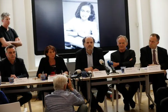 Ronald Leopold (C), executive director of the Anne Frank House, speaks during a press conference to present two unknown pages of Anne Frank's diary, on May 15, 2018 in Amsterdam. - Two pages of Anne Frank's world-famous diary - which she covered over with brown paper, discovering dirty jokes and a teenager's interest in sex - have been made visible with digital photo-editing techniques. (Photo by Bas CZERWINSKI / ANP / AFP) / Netherlands OUT        (Photo credit should read BAS CZERWINSKI/AFP/Getty Images)
