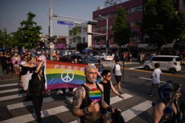 In a photo taken on May 26, 2018 participants of the 'Seoul Drag Parade' march in the Itaewon district of Seoul. - South Korea held its first ever drag parade this weekend, a small but significant step for rights activists in a country that remains deeply conservative when it comes to gender and sexuality. (Photo by Ed JONES / AFP)        (Photo credit should read ED JONES/AFP/Getty Images)