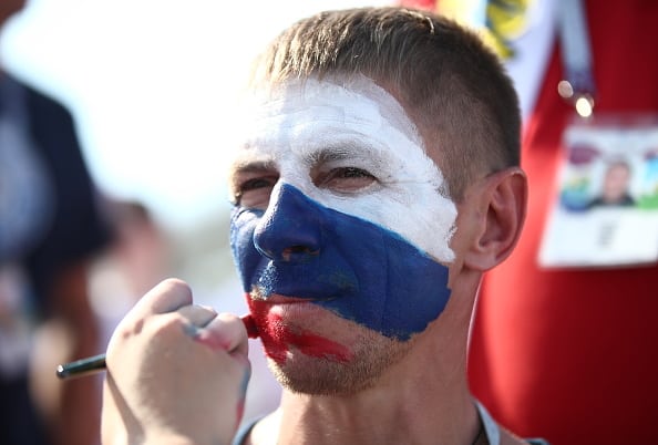 SAMARA, RUSSIA - JUNE 25, 2018: A fan of Team Russia has his face painted with the colours of the Russian flag outside Samara Arena ahead of a 2018 FIFA World Cup Group A football match between Russia and Uruguay. Valery Sharifulin/TASS (Photo by Valery SharifulinTASS via Getty Images)