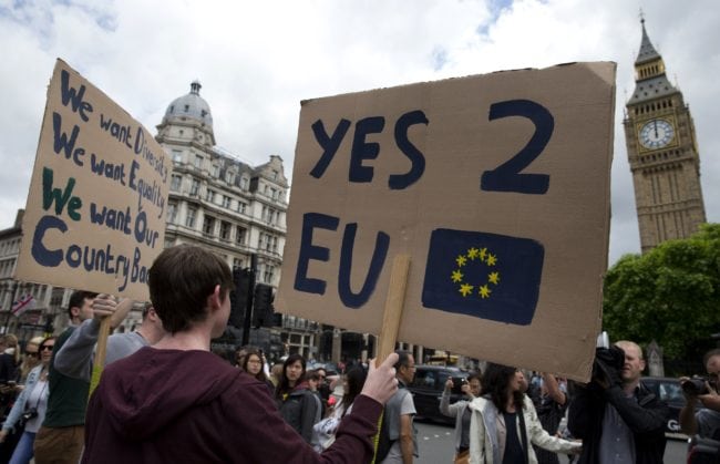A demonstrator holds a placard during a protest against the outcome of the UK's June 23 referendum on the European Union (EU), in central London on June 25, 2016. The result of Britain's June 23 referendum vote to leave the European Union (EU) has pitted parents against children, cities against rural areas, north against south and university graduates against those with fewer qualifications. London, Scotland and Northern Ireland voted to remain in the EU but Wales and large swathes of England, particularly former industrial hubs in the north with many disaffected workers, backed a Brexit. / AFP / JUSTIN TALLIS (Photo credit should read JUSTIN TALLIS/AFP/Getty Images)