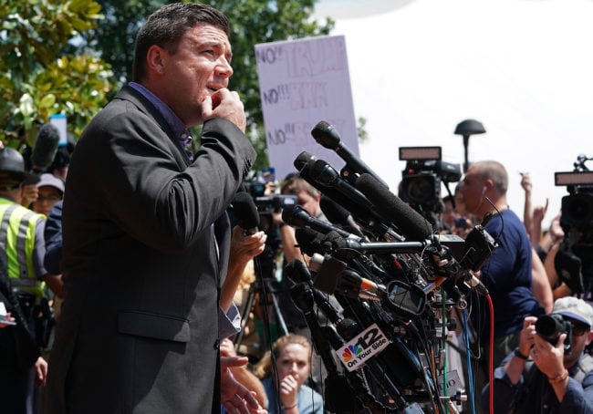 CHARLOTTESVILLE, VA - AUGUST 13:  Jason Kessler, an organizer of "Unite the Right" rally, tries to speak while being shouted down by counter protesters outside the Charlottesville City Hall on August 13, 2017 in Charlottesville, Virginia. The city of Charlottesville remains on edge following violence at a 'Unite the Right' rally held by white nationalists, neo-Nazis and members of the 'alt-right'  (Photo by Win McNamee/Getty Images)