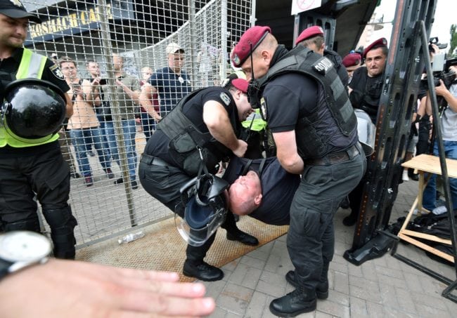 Policemen detain an anti-LGBT activist at Kyiv Pride (GENYA SAVILOV/AFP/Getty)