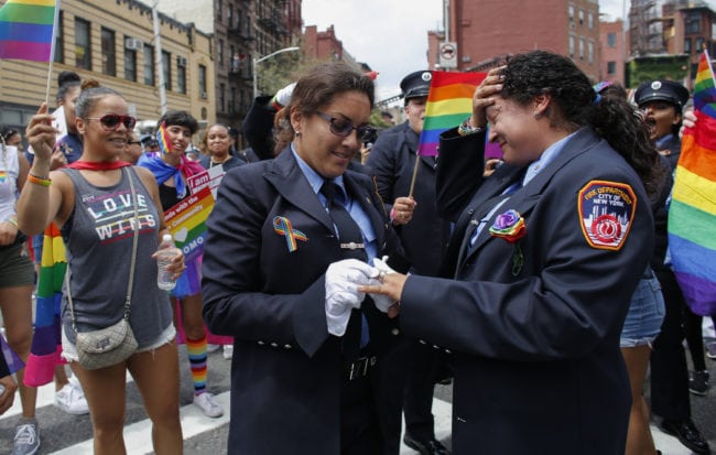 NEW YORK, NY - JUNE 24:  EMT Trudy Bermudez and paramedic Tayreen Bonilla of New York City Fire Department get engaged at the annual Pride Parade on June 24, 2018 in New York City. The first gay pride parade in the U.S. was held in Central Park on June 28, 1970.  (Photo by Kena Betancur/Getty Images)