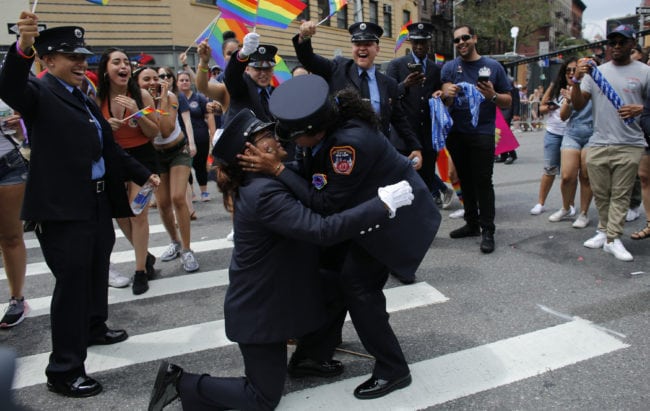 NEW YORK, NY - JUNE 24:  Members of the New York City Fire Department cheer as EMT Trudy Bermudez and paramedic Tayreen Bonilla get engaged at the annual Pride Parade on June 24, 2018 in New York City. The first gay pride parade in the U.S. was held in Central Park on June 28, 1970.  (Photo by Kena Betancur/Getty Images)
