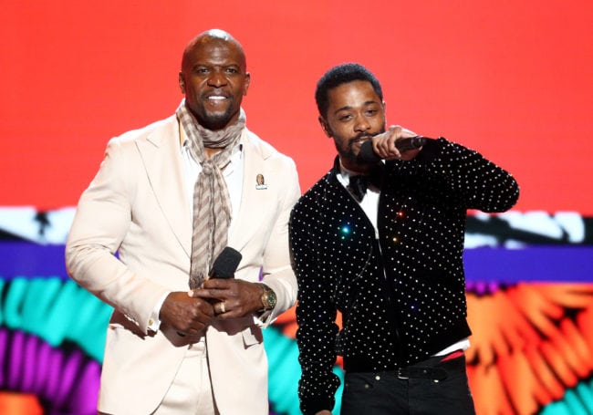 LOS ANGELES, CA - JUNE 24:  Terry Crews (L) and Lakeith Stanfield speak onstage at the 2018 BET Awards at Microsoft Theater on June 24, 2018 in Los Angeles, California.  (Photo by Frederick M. Brown/Getty Images for BET)