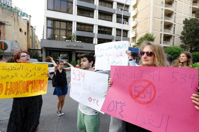 Activists from of the Lebanese LGBT community take part in a protest outside the Hbeish police station in Beirut on May 15, 2016, demanding the release of four transsexual women and calling for the abolishment of article 534 of the Lebanese Penal code, which prohibits having sexual relations that "contradict the laws of nature". / AFP / ANWAR AMRO (Photo credit should read ANWAR AMRO/AFP/Getty Images)