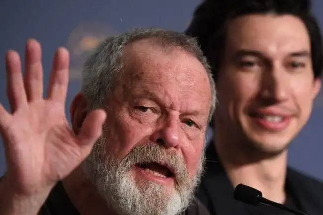 British-US director Terry Gilliam (L) waves as US actor Adam Driver looks on during a press conference on May 19, 2018 for the film "The Man Who Killed Don Quixote" at the 71st edition of the Cannes Film Festival in Cannes, southern France. (Photo by Laurent EMMANUEL / AFP) (Photo credit should read LAURENT EMMANUEL/AFP/Getty Images)