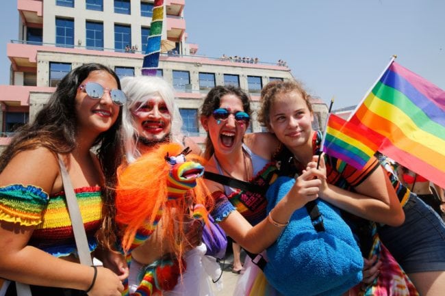 Revellers celebrate along a sea side avenue in Tel Aviv during the Israeli city's annual Gay Pride parade on June 8, 2018. - Tens of thousands of people gathered along the beach in the Israeli commercial capital Tel Aviv for the largest Gay Pride event in the Middle East. (Photo by GIL COHEN-MAGEN / AFP) (Photo credit should read GIL COHEN-MAGEN/AFP/Getty Images)