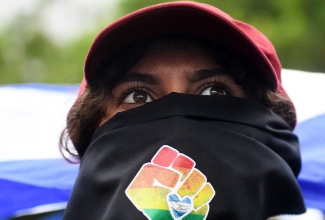 A person joins thousands of Nicaraguan anti-government protesters, including members of the Lesbian, Gay, Bisexual, Transgender/Transsexual and Intersexed (LGBTI) movement, in an national LGBTI march for Justice and Democracy, in Managua on June 28, 2018. - Nicaraguan human rights groups expressed renewed concern earlier this week over a rising death toll from months of protests against the government of President Daniel Ortega. (Photo by Marvin RECINOS / AFP)        (Photo credit should read MARVIN RECINOS/AFP/Getty Images)