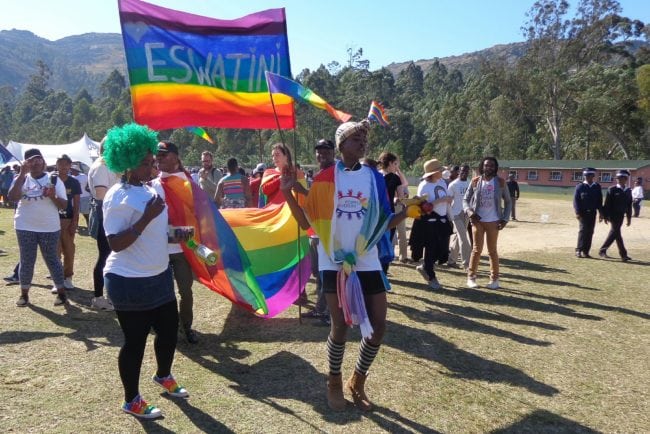 People take part in eSwatini's (formerly known as Swaziland) first Gay Pride in Mbabane on June 30, 2018. - Hundreds of protestors attended eSwatini's first gay pride march on June 30, 2018, calling for equality and rights in a country where homosexuality is outlawed by the absolute monarchy. About 500 people turned up for the historic march in Mbabane, the country's largest city, draped in the rainbow flag, international symbol of the LGBTIQ community, and wearing T-shirts printed with the message "God is love". (Photo by MONGI ZULU / AFP)        (Photo credit should read MONGI ZULU/AFP/Getty Images)