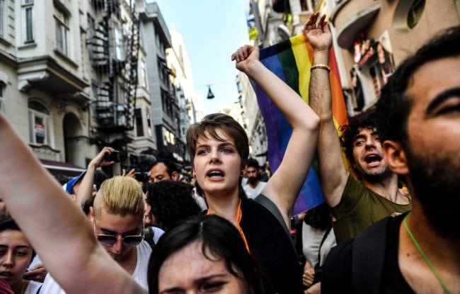 LGBT rights activists shout slogans as they take part in a march on July 1, 2018 in Istanbul, after Turkish authorities banned the annual Gay Pride Parade for a fourth year in a row. - Around 1,000 people gathered on a street near Istiklal Avenue and Taksim Square where organisers wanted to originally hold the parade, an AFP photographer said. Police warned activists to disperse but used rubber bullets against some who tried to access Istiklal Avenue. (Photo by BULENT KILIC / AFP)        (Photo credit should read BULENT KILIC/AFP/Getty Images)