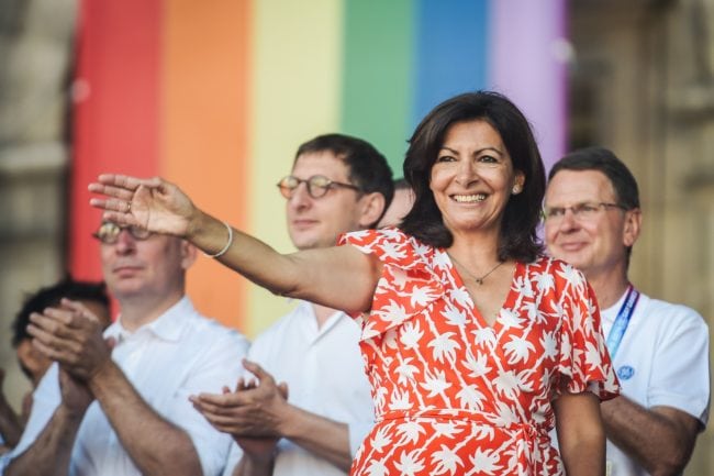 Paris mayor Anne Hidalgo waves as she arrives on stage to deliver a speech during the inauguration of the sport village of the 2018 Gay Games' edition, on the Parvis de l'Hotel de Ville, in Paris, on August 4, 2018, on the sidelines of the opening of the Gay Games. - French capital, Paris, hosts the Gay Games from August 4, 2018 to August 12, 2018 bringing together participants from around the world for a week of sport and culture in a carnival atmosphere. Paris will welcome more than 10,000 participants from 90 countries around the world, including some where homosexuality is illegal or repressed. (Photo by Lucas Barioulet / AFP)        (Photo credit should read LUCAS BARIOULET/AFP/Getty Images)