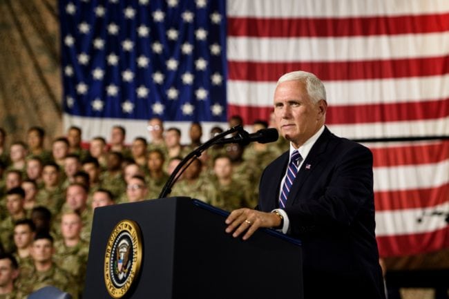 US Vice President Mike Pence introduces US President Donald Trump during a signing ceremony ceremony for the John S. McCain National Defense Authorization Act for Fiscal Year 2019 at Fort Drum, New York, on August 13, 2018. (Photo by Brendan Smialowski / AFP)        (Photo credit should read BRENDAN SMIALOWSKI/AFP/Getty Images)