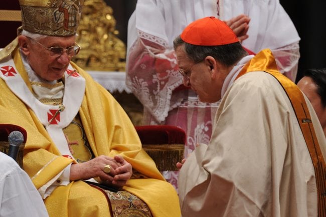 Pope Benedict XVI (L) gives his cardinal ring to  US Raymond leo Burke (R) during the Eucharistic celebration with the new cardinals on November 21, 2010 at St Peter's basilica at The Vatican. 24 Roman Catholic prelates joined the day before the Vatican's College of Cardinals, the elite body that advises the pontiff and elects his successor upon his death.  AFP PHOTO / ALBERTO PIZZOLI (Photo credit should read ALBERTO PIZZOLI/AFP/Getty Images)