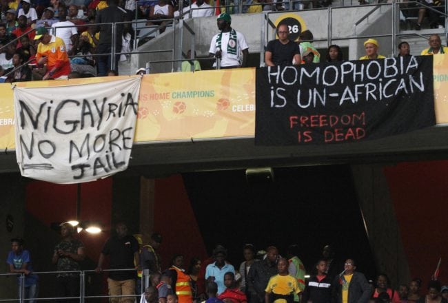 CAPE TOWN, SOUTH AFRICA - JANUARY 19: Banners in protest at the Anti-Gay Marrage Law recently passed in Nigeria are displayed in the crowd during the 2014 African Nations Championship match between South Africa and Nigeria at Cape Town Stadium on January 19, 2014 in Cape Town, South Africa. (Photo by Shaun Roy/Gallo Images/Getty Images)