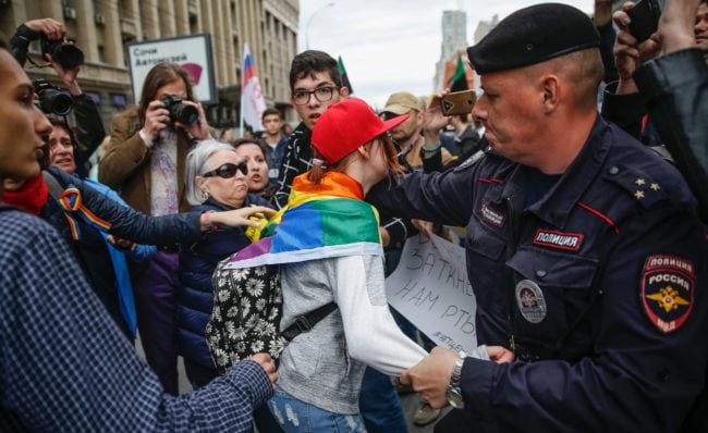 Policemen detain a LGBT activist during a protest in Moscow on August 26, 2017. Nearly 1,000 Russians protested during a demonstration against the intensification of surveillance and restrictions on the Internet, marked by at least eight arrests. / AFP PHOTO / Maxim ZMEYEV (Photo credit should read MAXIM ZMEYEV/AFP/Getty Images)