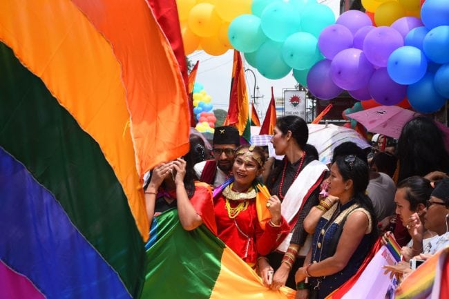 This photo taken on August 8, 2017 shows Nepali transgender person Monika Shahi Nath taking part in a gay pride parade in Kathmandu. Monika Shahi Nath, 40, became Nepal's first transgender person to be issued with a marriage certificate by district officials when she married 22-year-old Ramesh Nath Yogi in May, even though Nepal has no formal laws for such unions. The couple have found a rare acceptance in Nepal, where many transgender people still struggle to be open about their identity despite progressive laws that include a third gender option on identity cards and passports. / AFP PHOTO / Prakash MATHEMA / TO GO WITH Nepal-transgender-marriage-rights (Photo credit should read PRAKASH MATHEMA/AFP/Getty Images)