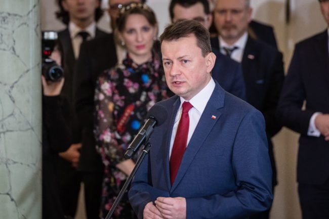 Newly-appointed Defence Minister Minister Mariusz Blaszczak on January 9, 2018 speaks during a ceremony at the presidential palace in Warsaw, following a sweeping reshuffle of the government.  Poland's new rightwing Prime Minister Mateusz Morawiecki has sacked his defence and foreign ministers in a major cabinet reshuffle that comes just over a month after his own appointment. Controversial defence minister Antoni Macierewicz and foreign minister Witold Waszczykowski lost their jobs along with environment minister Jan Szyszko among others as Morawiecki seeks to mend ties with Poland's EU partners strained since his Law and Justice (PiS) party took office in 2015. / AFP PHOTO / Wojtek RADWANSKI / The erroneous mention[s] appearing in the metadata of this photo by Wojtek RADWANSKI has been modified in AFP systems in the following manner: [Mariusz Blaszczak ] instead of [Jacek Czaputowicz]. Please immediately remove the erroneous mention[s] from all your online services and delete it (them) from your servers. If you have been authorized by AFP to distribute it (them) to third parties, please ensure that the same actions are carried out by them. Failure to promptly comply with these instructions will entail liability on your part for any continued or post notification usage. Therefore we thank you very much for all your attention and prompt action. We are sorry for the inconvenience this notification may cause and remain at your disposal for any further information you may require.        (Photo credit should read WOJTEK RADWANSKI/AFP/Getty Images)