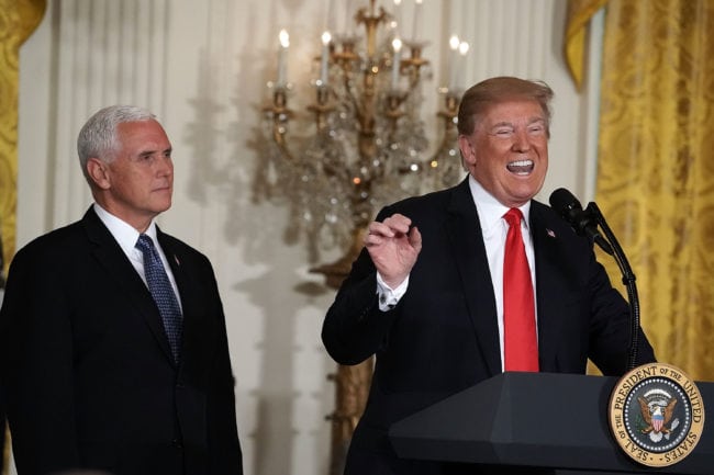 WASHINGTON, DC - JUNE 18:  U.S. President Donald Trump (R) speaks as Vice President Mike Pence (L) look on during a meeting of the National Space Council at the East Room of the White House June 18, 2018 in Washington, DC. It's the first time President Trump attended the public meeting of the council.  (Photo by Alex Wong/Getty Images)