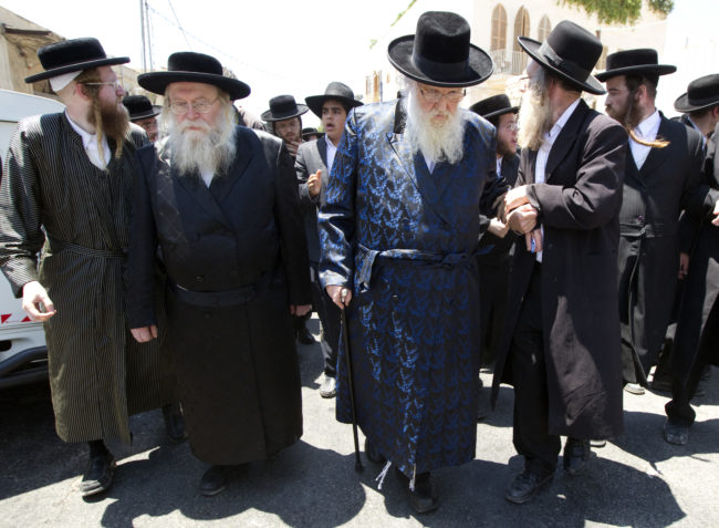 Rabbi Sternbuch (2nd-R) leaves after a protest against the removal of ancient tombs in Jaffa, just south of Tel Aviv, on June 14, 2010 where construction is due to take place at the site where religious men say Jewish graves are located. AFP PHOTO/JACK GUEZ (Photo credit should read JACK GUEZ/AFP/Getty Images)