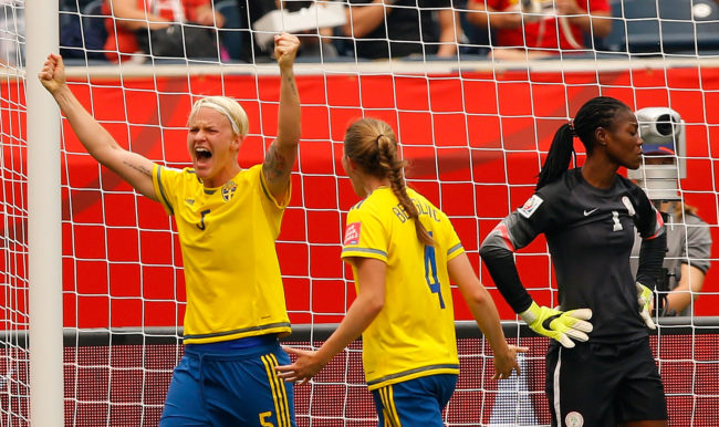 WINNIPEG, MB - JUNE 08:  Nilla Fischer #5 of Sweden reacts after scoring the second goal against goalkeeper Precious Dede #1 of Nigeria with Emma Berglund #4 during the FIFA Women's World Cup Canada 2015 Group D match between Sweden and Nigeria at Winnipeg Stadium on June 8, 2015 in Winnipeg, Canada.  (Photo by Kevin C. Cox/Getty Images)