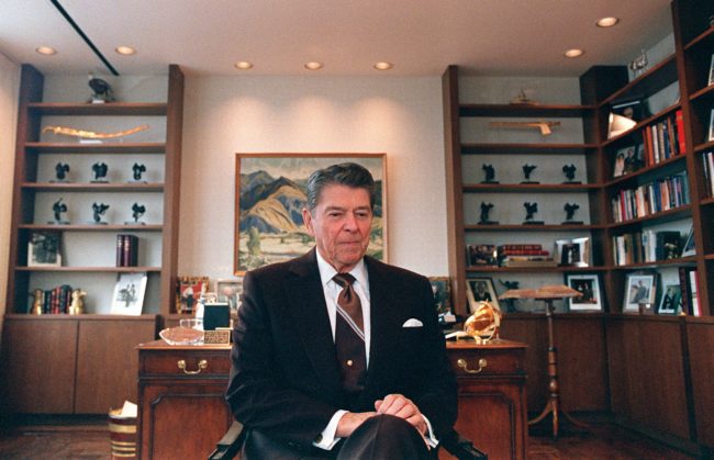 Former US President Ronald Reagan sits 09 June 1989 in his office in Century City near Los Angeles. Reagan was US president from 1980 to 1988. (Photo credit should read CARLOS SCHIEBECK/AFP/Getty Images)
