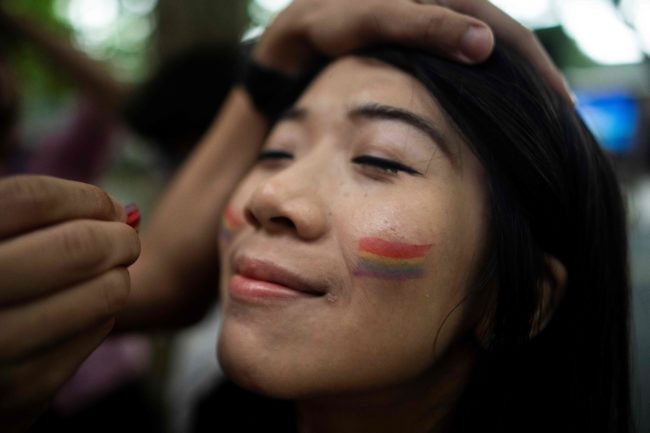 A participant prepares for a Pride Run, an event of the ShanghaiPRIDE LGBT (lesbian, gay, bisexual and transgendered) celebration in Shanghai, June 9, 2018. (Photo by Johannes EISELE / AFP) (Photo credit should read JOHANNES EISELE/AFP/Getty Images)