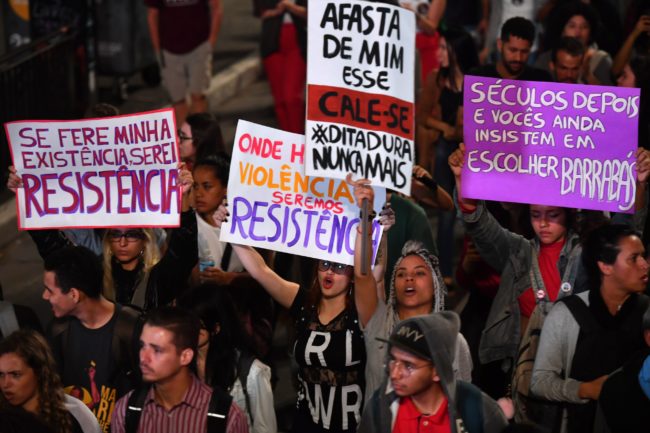 Demonstrators take part in a protest against Brazilian right-wing presidential candidate Jair Bolsonaro in Sao Paulo, Brazil, on October 10 2018. - The populist ultra-conservative won 46 percent of the vote in the first round, despite detractors highlighting his contentious past comments demeaning women and gays, and speaking in favor of torture and Brazil's 1964-1985 military dictatorship. Brazil will hold the run-off presidential election next October 28. (Photo by NELSON ALMEIDA / AFP) (Photo credit should read NELSON ALMEIDA/AFP/Getty Images)