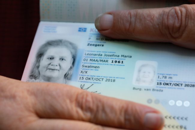 Leonne Zeegers, 57, receives a passeport with the gender designation X, instead of M for man or V for woman in Breda, on October 19, 2018. - The first gender-neutral passport of The Netherlands was issued. (Photo by Bas Czerwinski / ANP / AFP) / Netherlands OUT (Photo credit should read BAS CZERWINSKI/AFP/Getty Images)