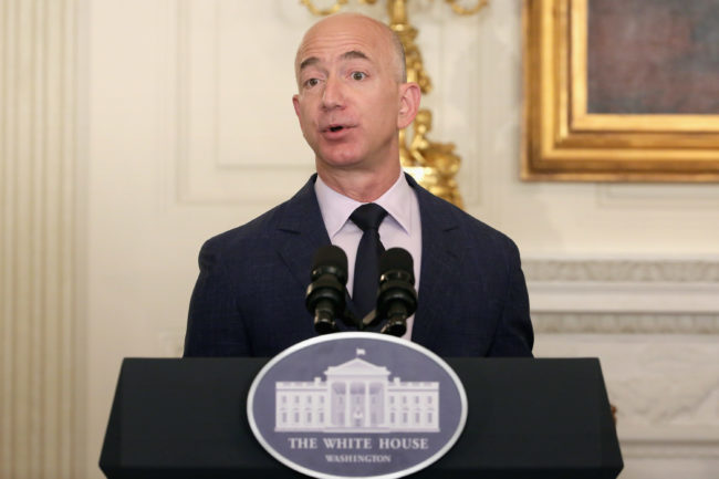 WASHINGTON, DC - MAY 05: Amazon founder and CEO Jeff Bezos delivers remarks during an event announcing commitments from more than 50 companies that have pledged to hire and train veterans and military spouses in the State Dining Room at the White House May 5, 2016 in Washington, DC. On the fifth anniversary of first lady Michelle Obama and Dr. Jill Biden's military hiring initiative Joining Forces, Bezos announced a commitment by his company to hire 25,000 more military veterans in the next five years. (Photo by Chip Somodevilla/Getty Images)