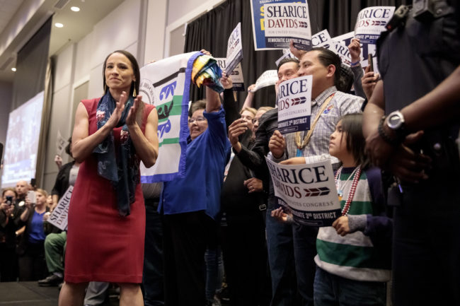 Sharice Davids celebrates on stage with supporters during an election night party on November 6, 2018 in Olathe, Kansas. (Whitney Curtis/Getty)